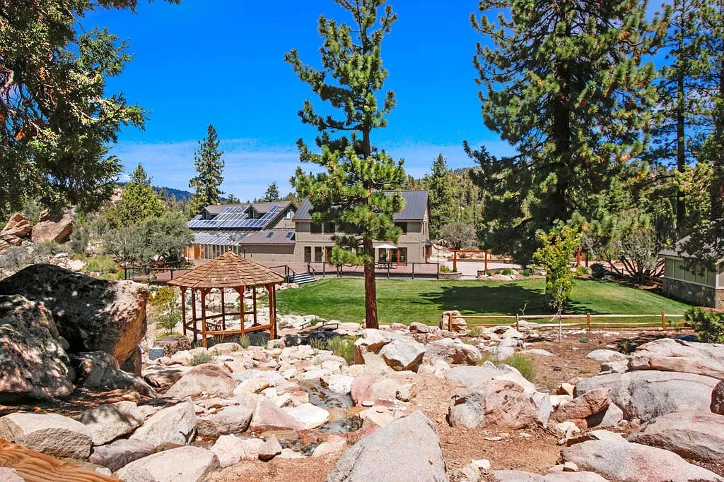 Boulders and stream crossing toward the lawn, gazebo and main Lodge