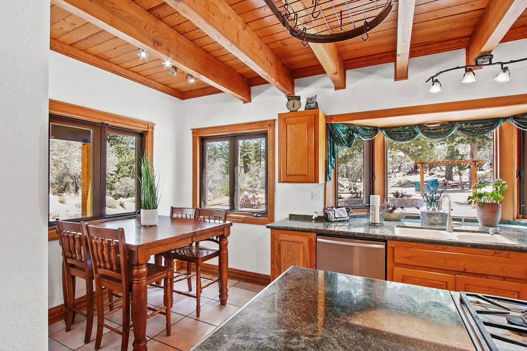 Breakfast nook with windows over the wooded grounds